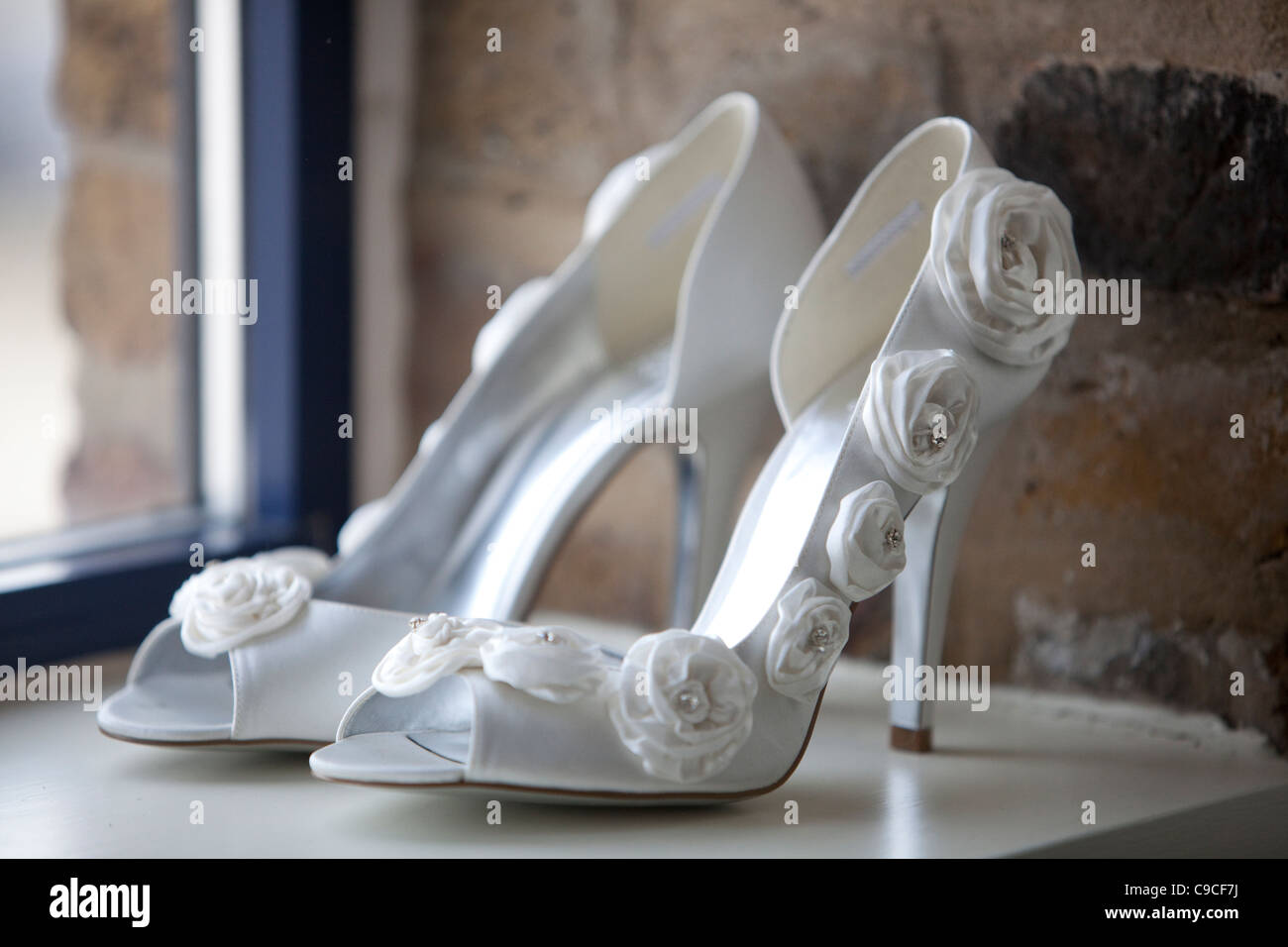 White wedding shoes with roses on 