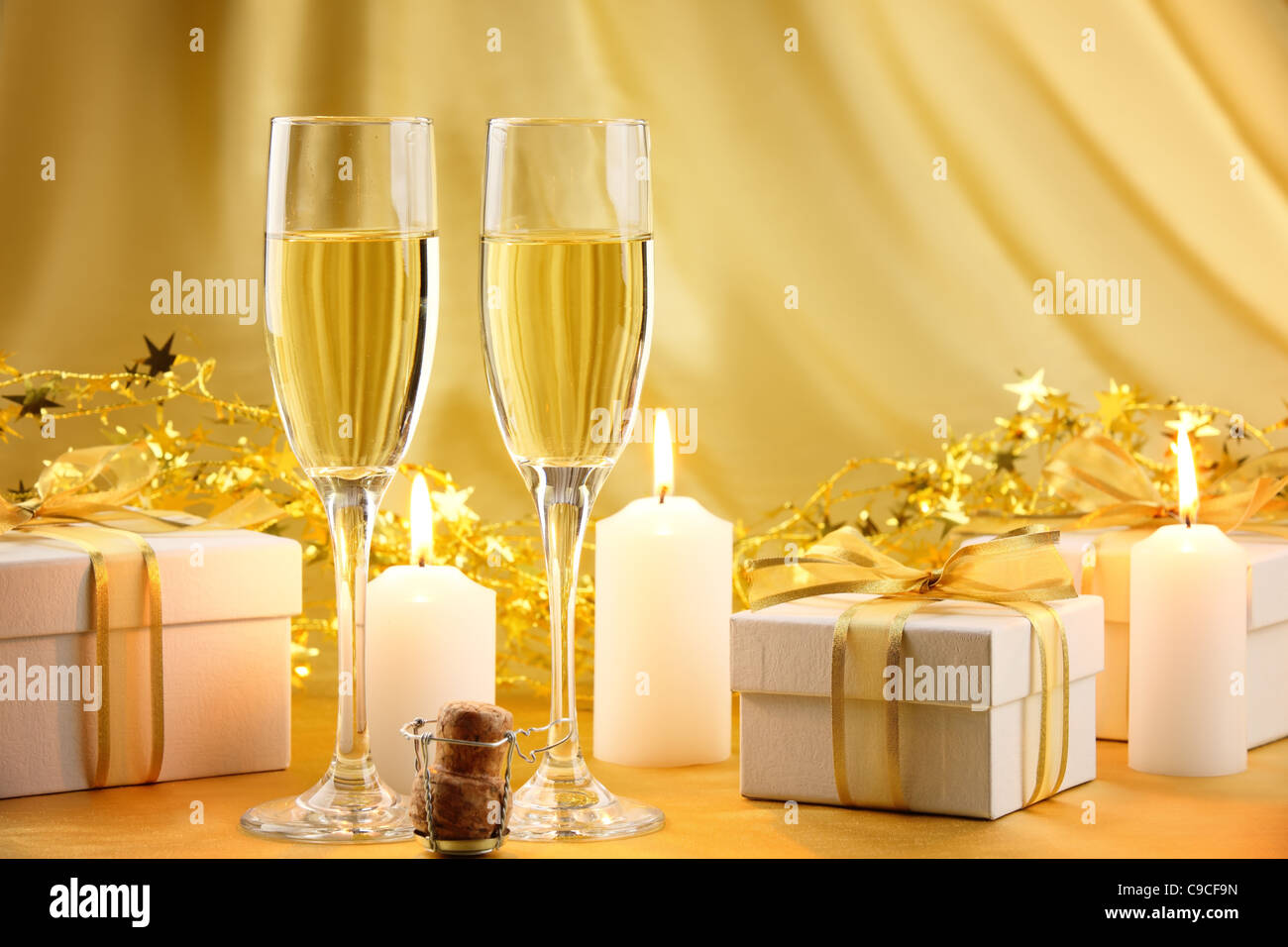 Glasses of champagne with gift boxes. Stock Photo