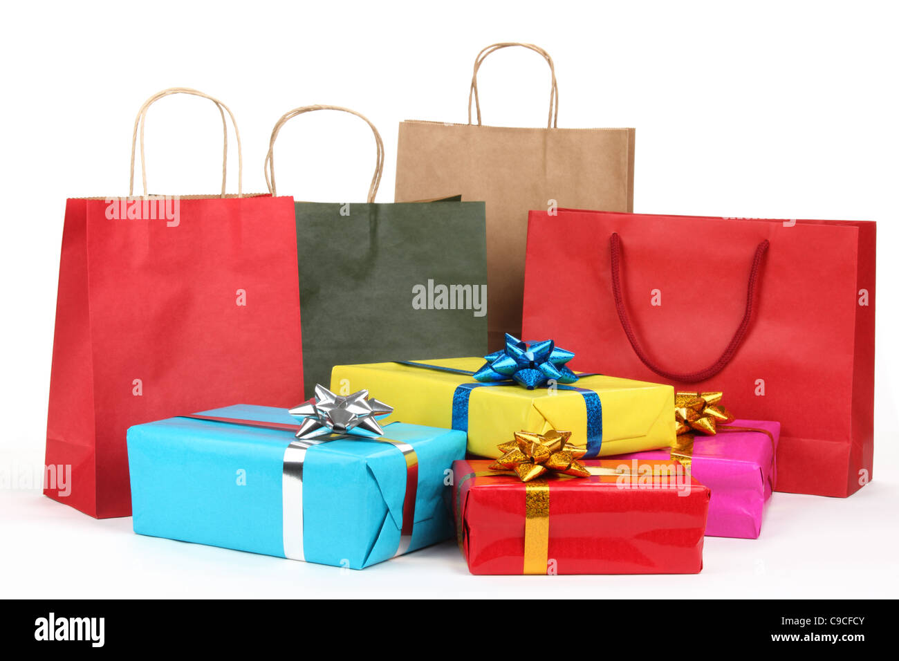 Holiday shopping bags and gift boxes on white background Stock Photo