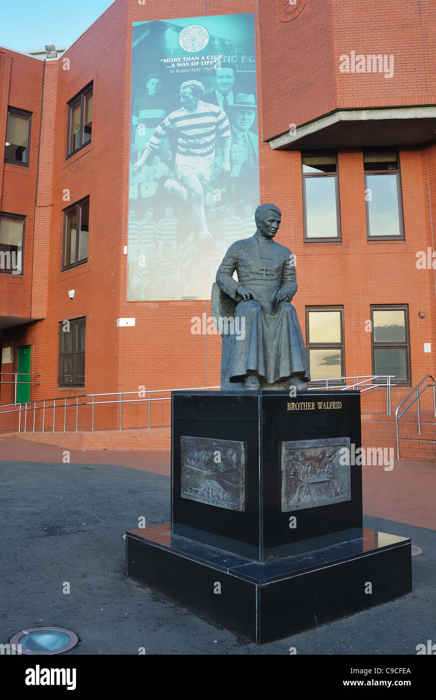 A statue dedicated to Club founder and priest Brother Walfrid stands outside the stadium entrance at Celtic Football Club. Stock Photo