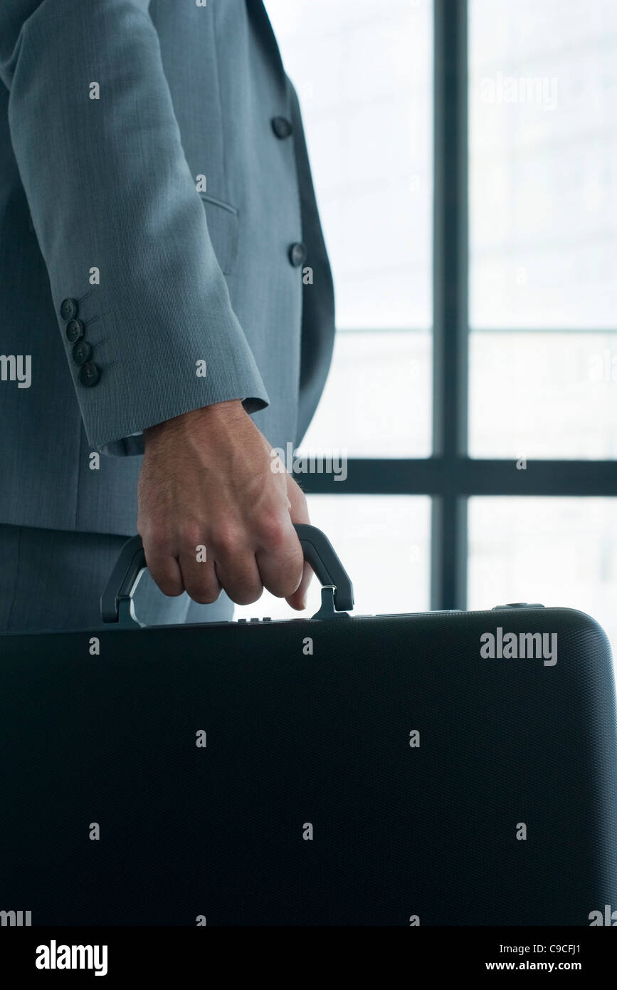 Executive carrying briefcase Stock Photo Alamy