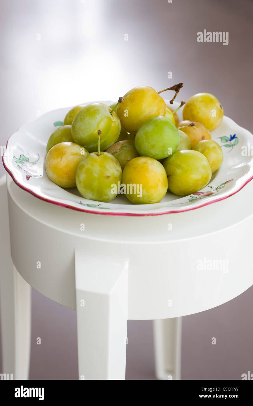 Greengage plums in bowl Stock Photo