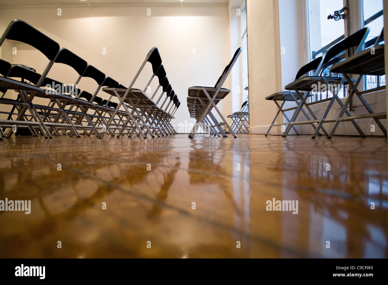 Folding chairs lined up in empty conference room Stock Photo Alamy