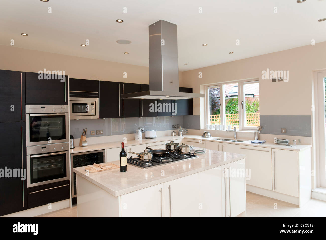 New modern fitted kitchen in large house, England, UK Stock Photo