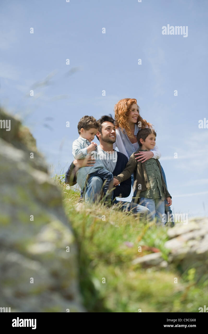 Parents and young boys in nature Stock Photo