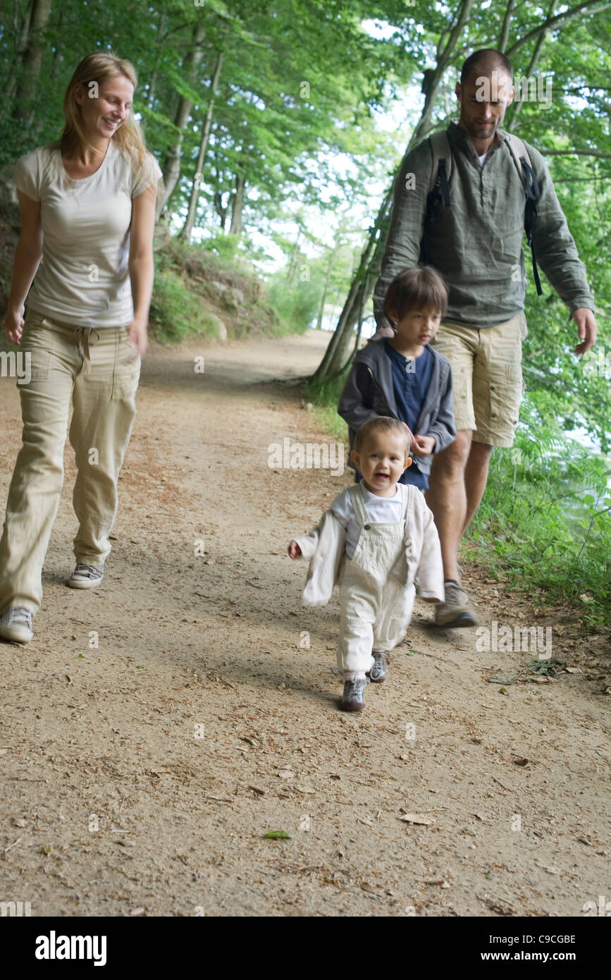 Family hiking in woods Stock Photo