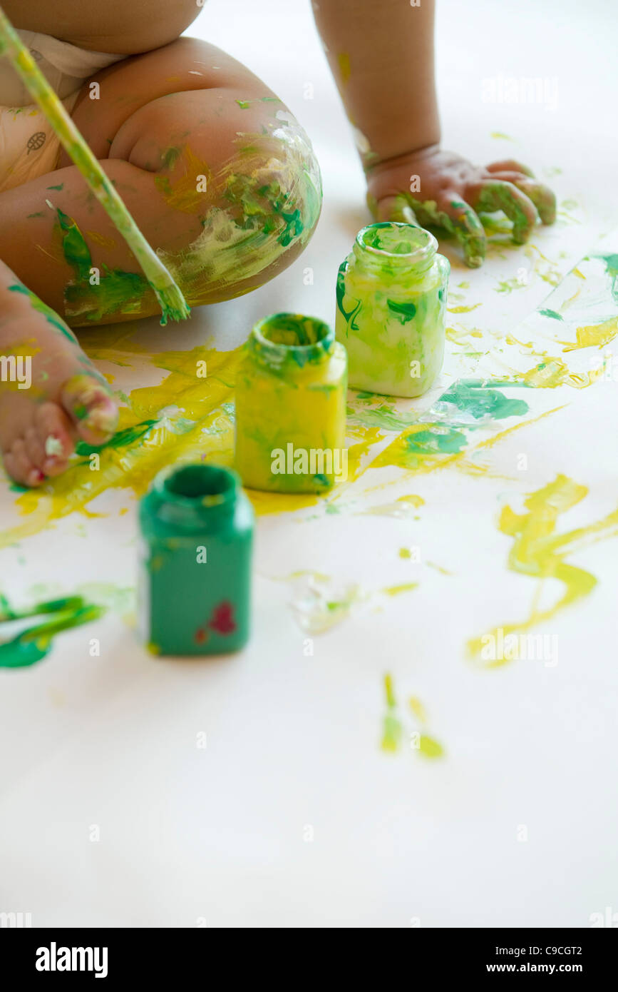 Baby playing with paint, cropped Stock Photo Alamy