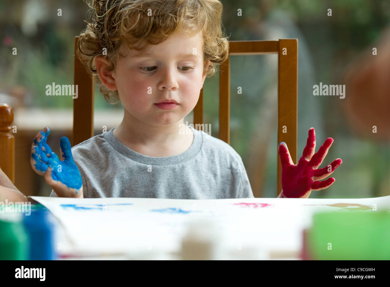 Little boy finger painting Stock Photo