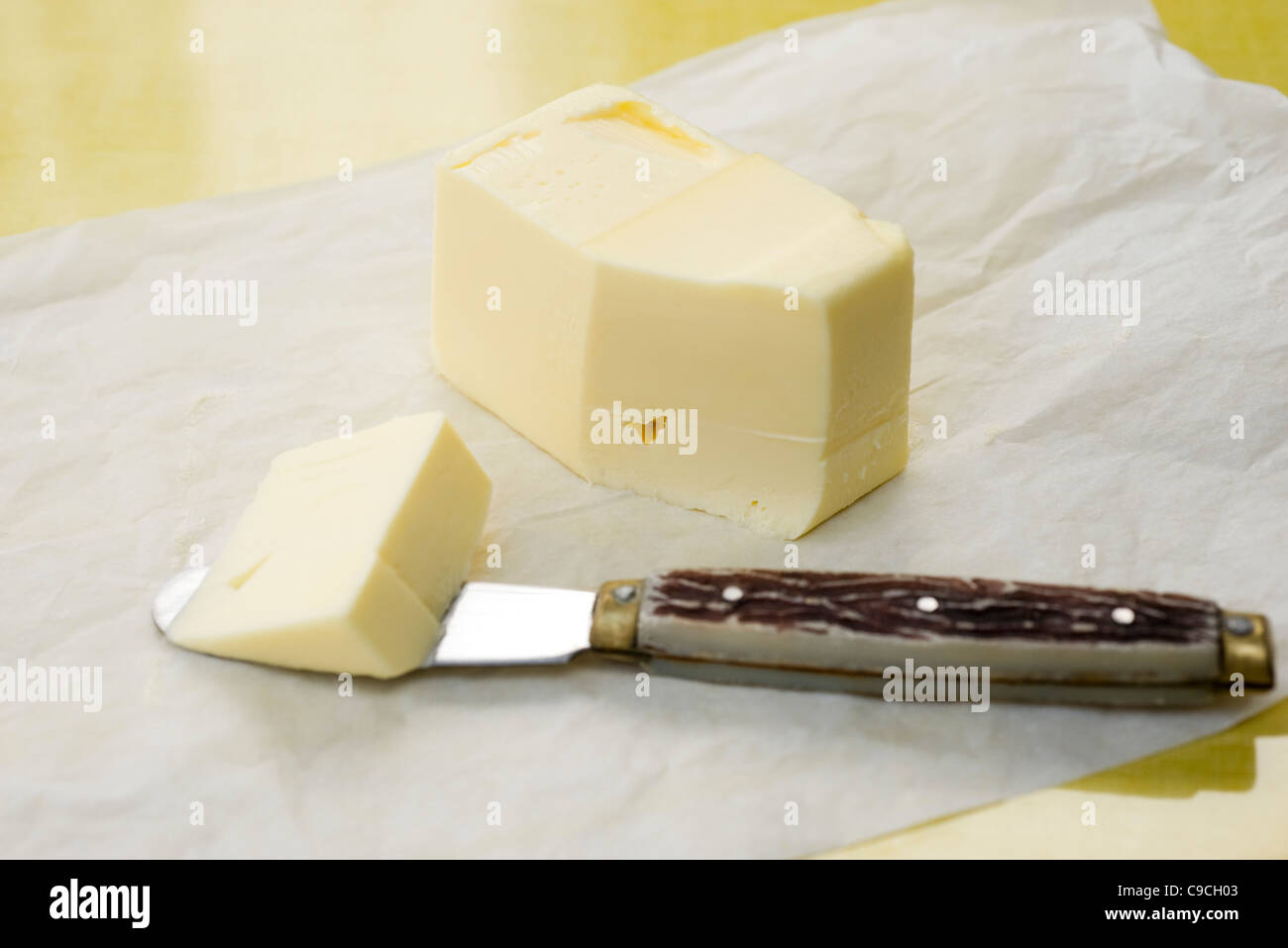Cutting butter Stock Photo