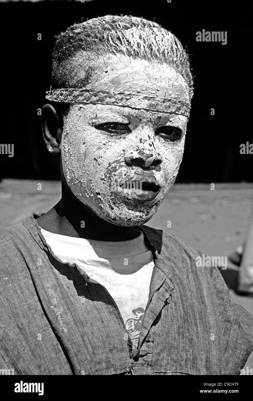 Portrait of Young Antambahoaka Warrior or Malagasy Boy Covered in Face Paint or White Face Mask, Sambatra Circumcision Ceremony,  Mananjary, Madagascar Stock Photo