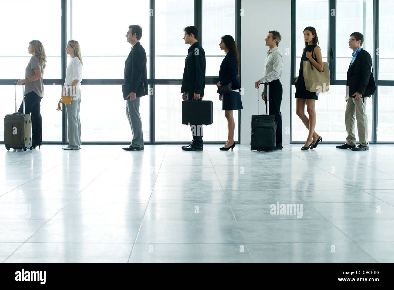 Business people standing in line Stock Photo