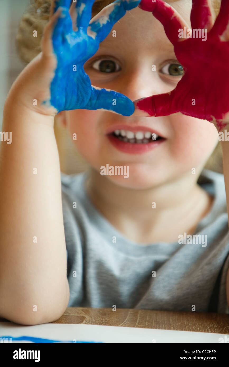 Kids hand covered in paint hi-res stock photography and images - Alamy