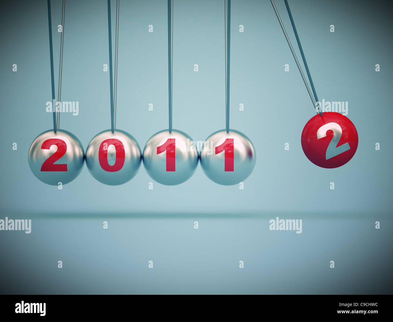 3d image of newton cradle with 2012 text Stock Photo - Alamy