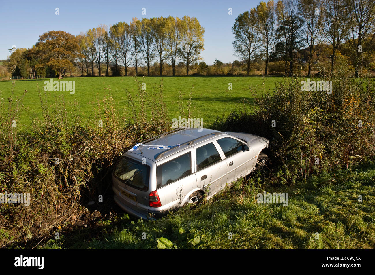 car crash uk - Vauxhall Vectra estate car in hedge in countryside at Glasbury-on-Wye Powys Wales UK Stock Photo