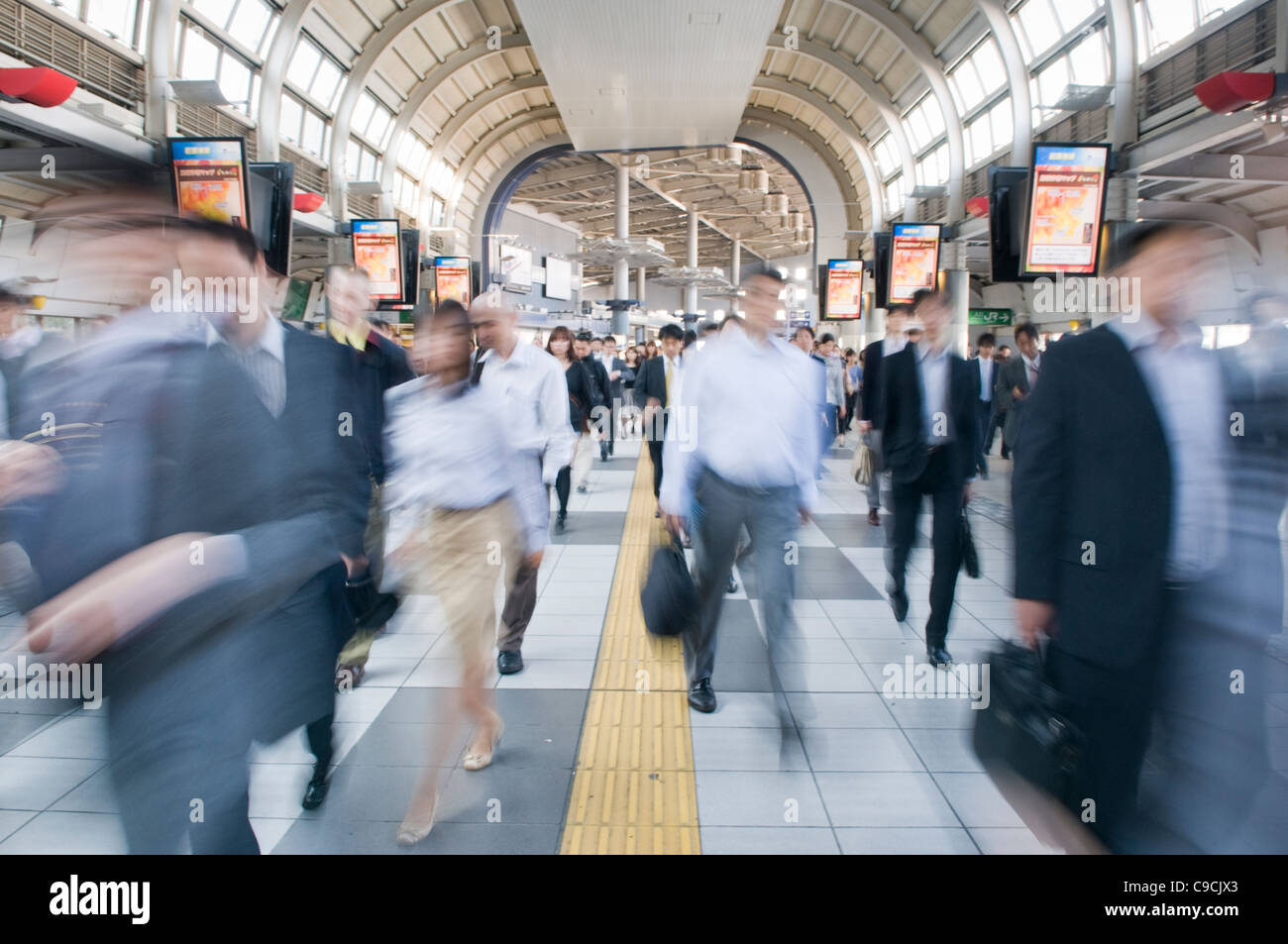 Commuters at a Tokyo rail way station, Japan Stock Photo