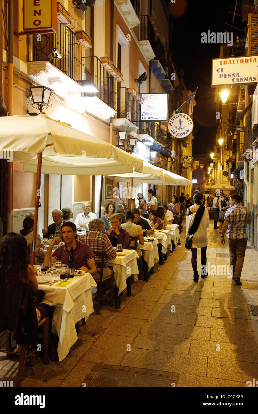 People sitting at an outdoors restaurant in the marina area, Cagliari, Sardinia, Italy. Stock Photo