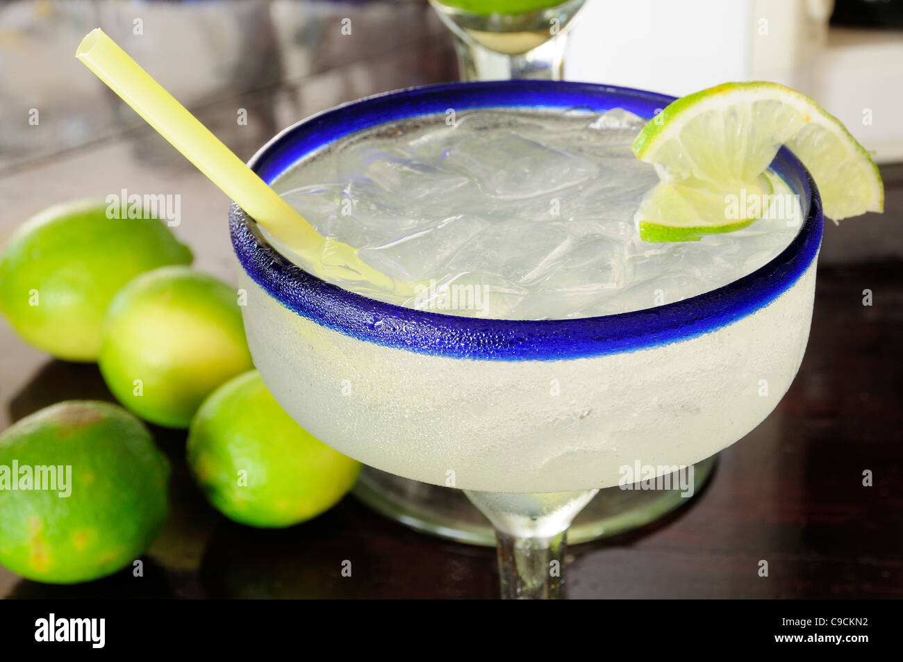 Mexico, Jalisco, Puerto Vallarta, Frosted glass of a margarita cocktail served with ice and slice of lime Stock Photo