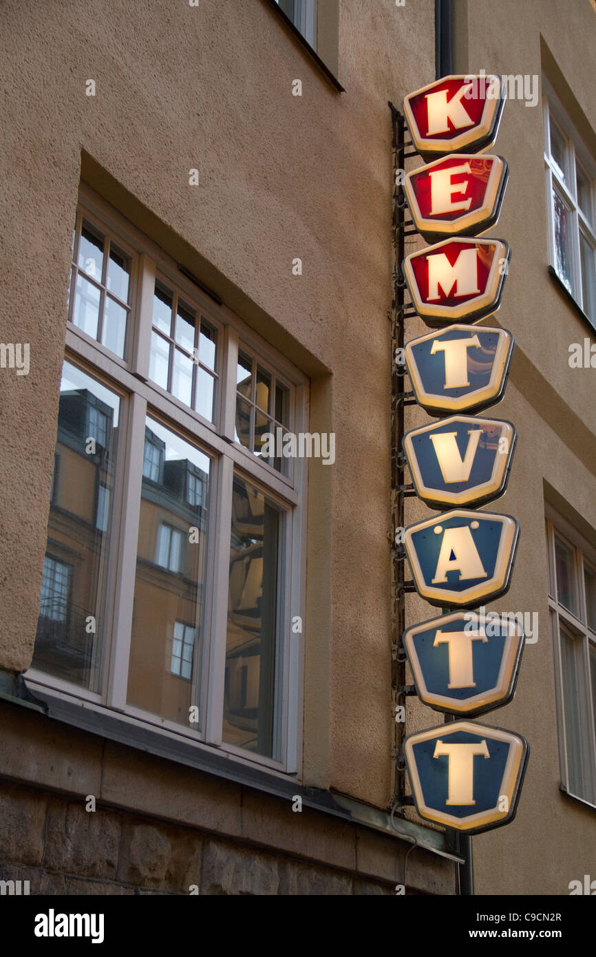 Vertcial red and blue Kemtvätt, dry cleaning sign on building in Stockholm, Sweden Stock Photo
