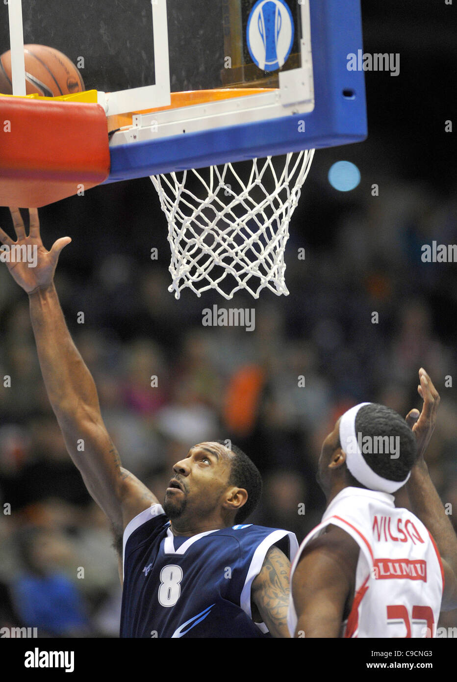 Jason Dourisseau of Groningen (left) and Lamayn Wilson of Nymburk during the Eurocup basketball match ULEB CEZ Nymburk vs Groningen in Pardubice, Czech Republic on November 22, 2011. (CTK Photo/Alexandra Mlejnkova) Stock Photo