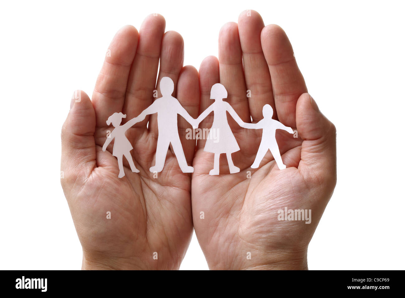 Paper chain family protected in cupped hands Stock Photo