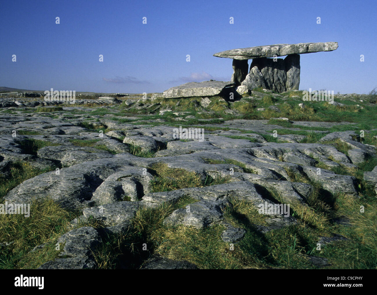 The Poulnabrone Dolmen sits on the limestone pavement of The Burren, County Clare, Rep of Ireland. Stock Photo