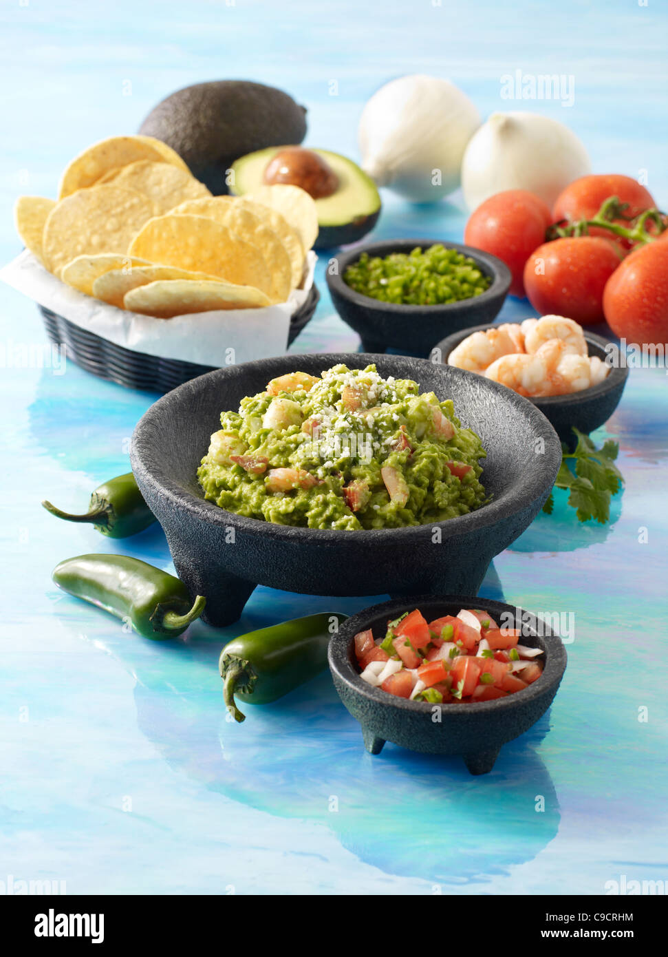 Guacamole with shrimp, chips and salsa fresca Stock Photo