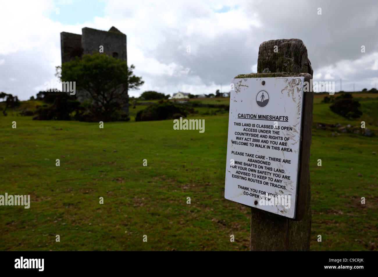 Sign warning of subsidence danger due to disused tin mine shafts , near Minions , Bodmin Moor , Cornwall , England Stock Photo