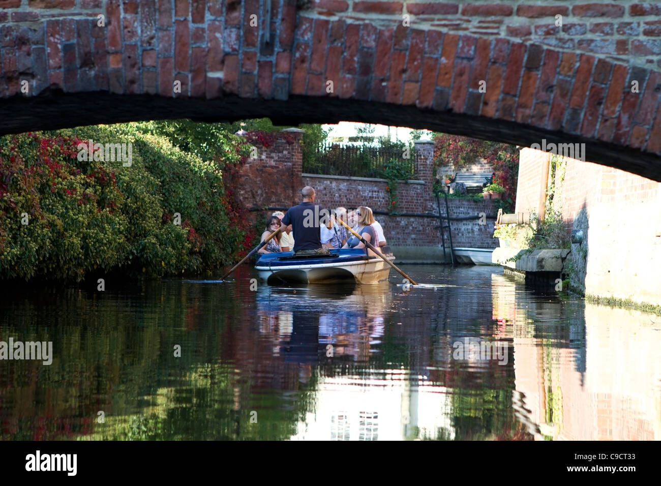Tourists on a rowing boat on the River Stour in Canterbury, England Stock Photo