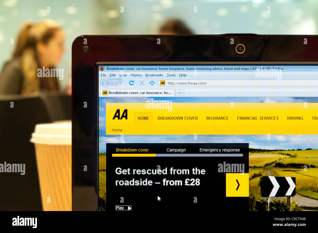 The AA website shot in a coffee shop environment (Editorial use only: print, TV, e-book and editorial website). Stock Photo