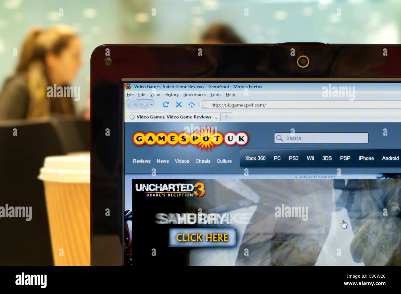 The Gamespot website shot in a coffee shop environment (Editorial use only: print, TV, e-book and editorial website). Stock Photo