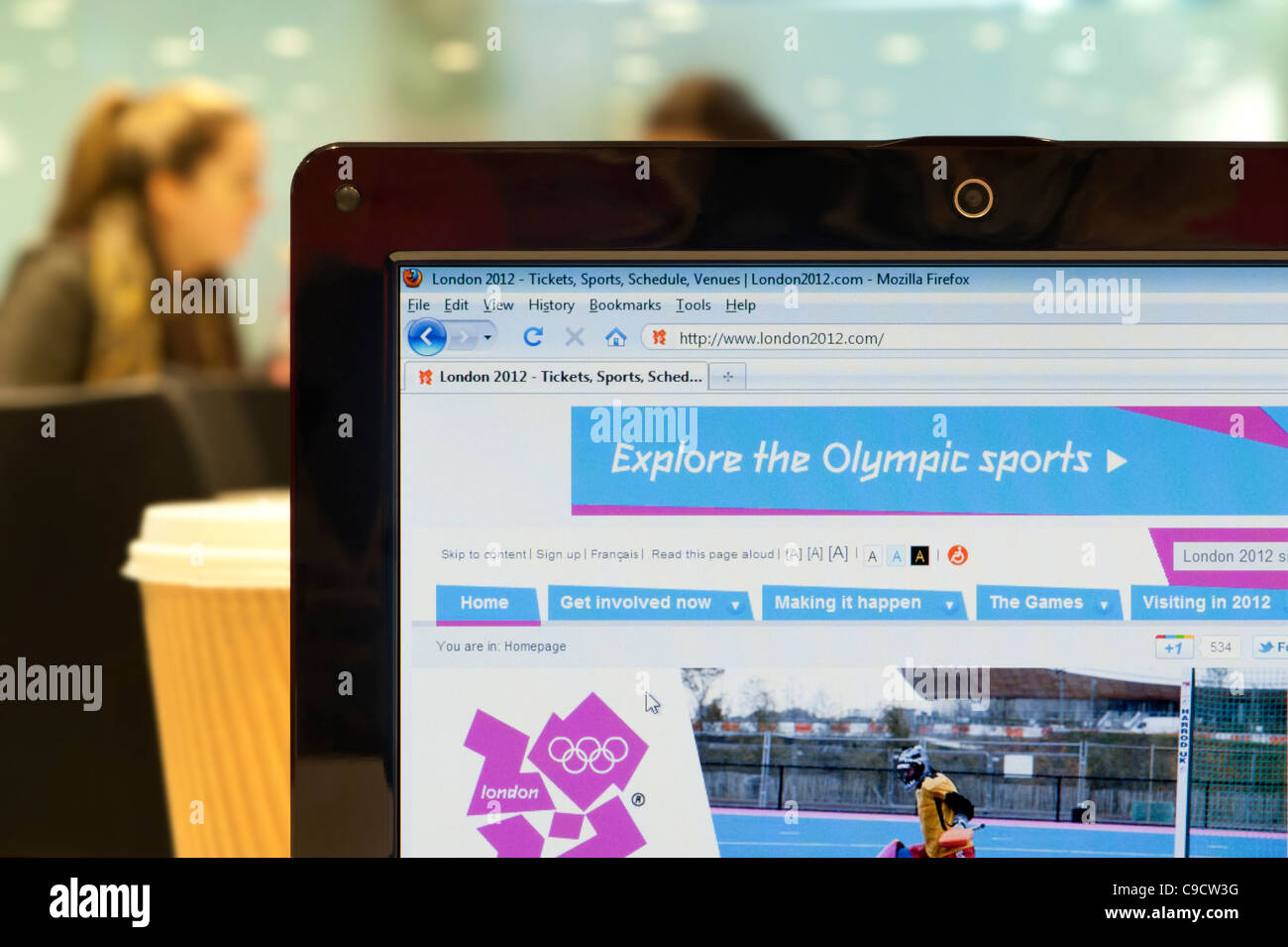 The London 2012 website shot in a coffee shop environment (Editorial use only: print, TV, e-book and editorial website). Stock Photo