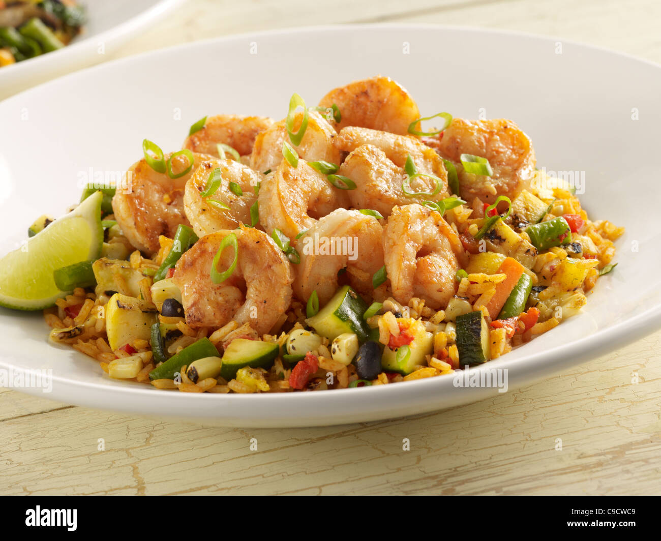 Spicy shrimp with vegetables and Spanish rice Stock Photo