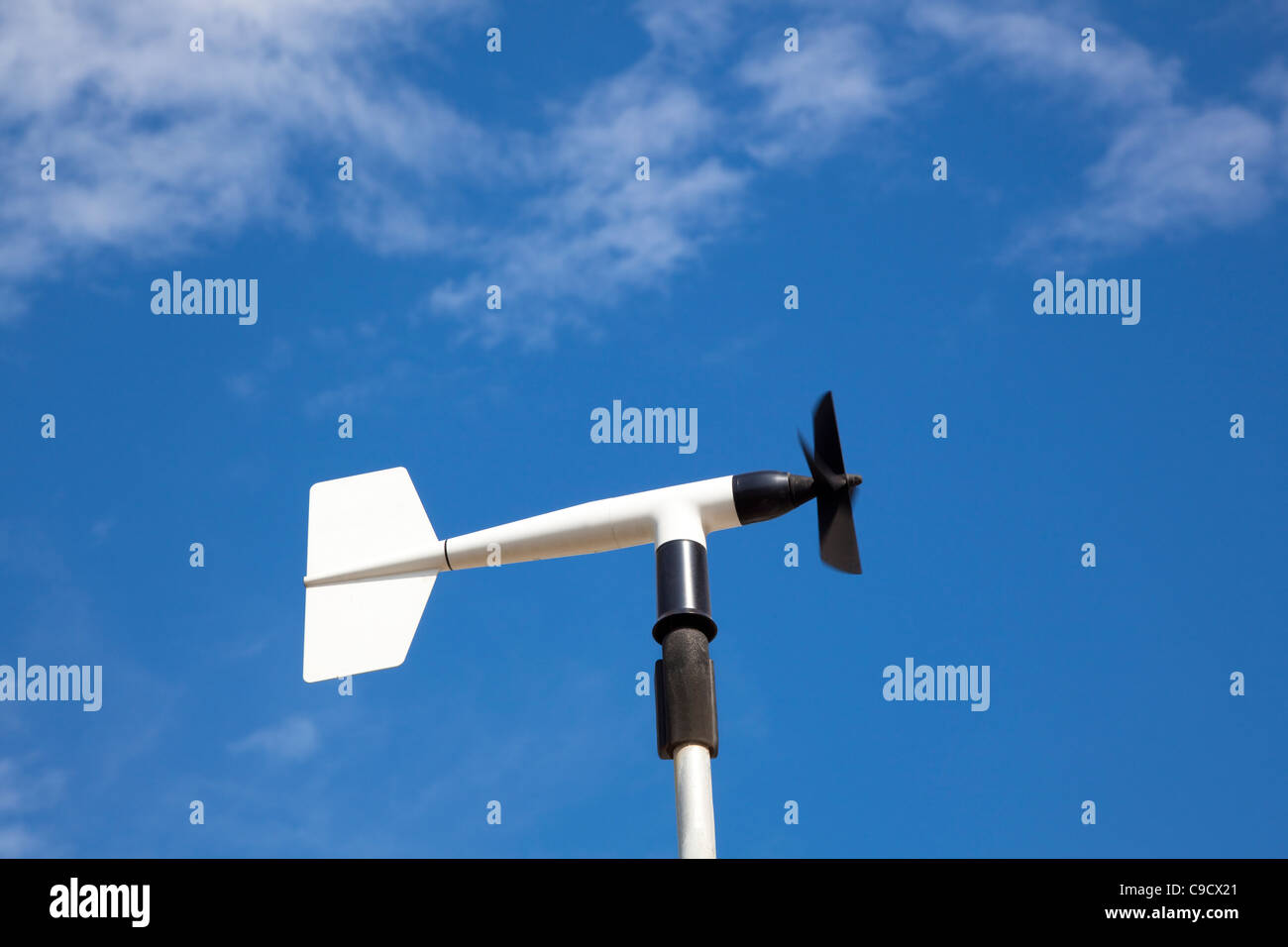 wind wheel or anemometer with cloud background Stock Photo