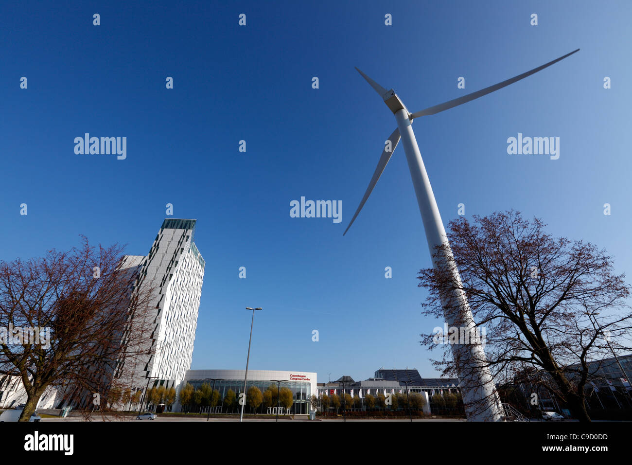 The large Vestas wind turbine and the spectacular Bella Sky Comwell Hotel at the Bella Center in Ørestaden Copenhagen, Denmark Stock Photo