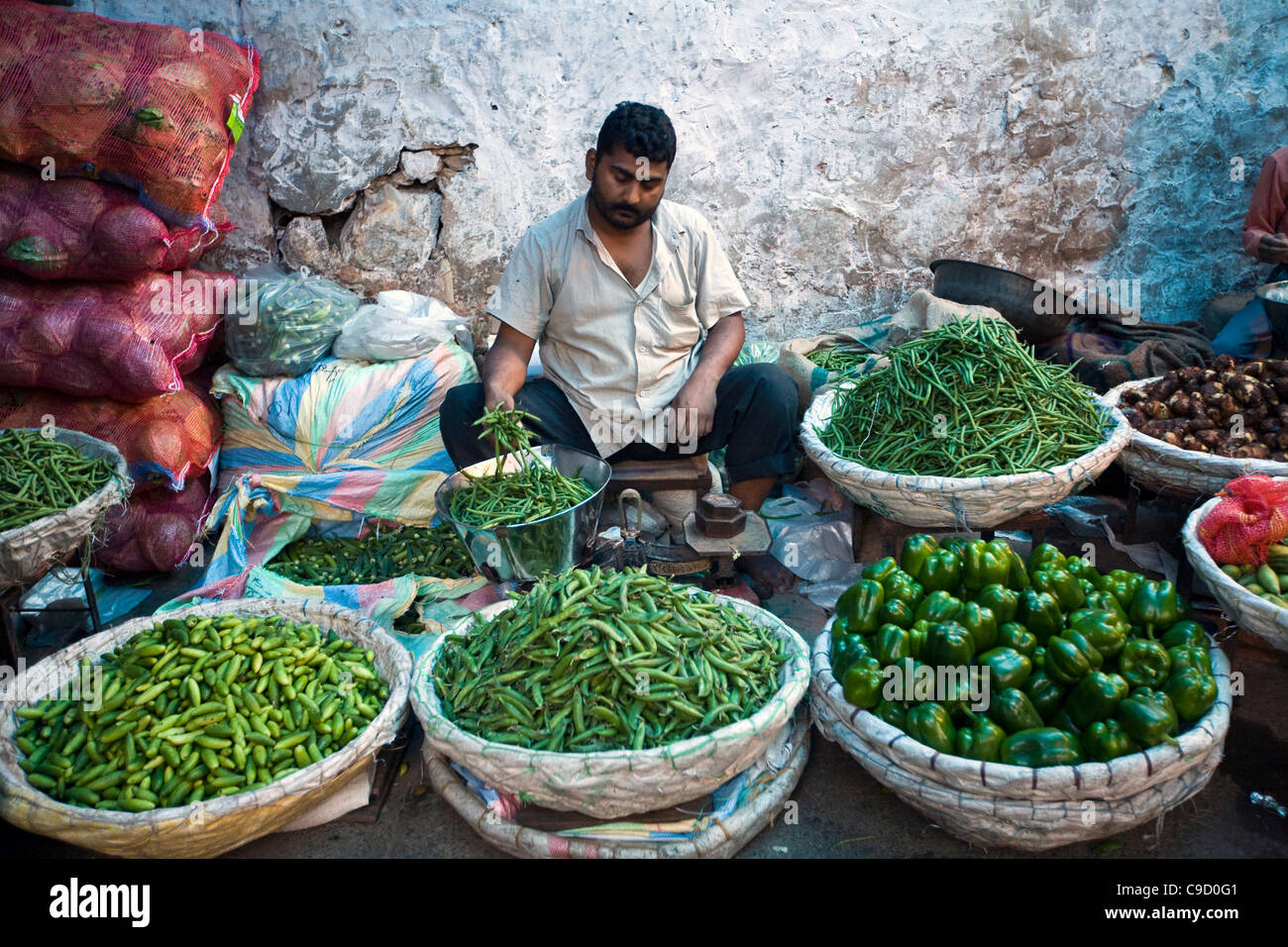 A vegetable seller in the market in Mehrauli, Delhi, India Stock Photo