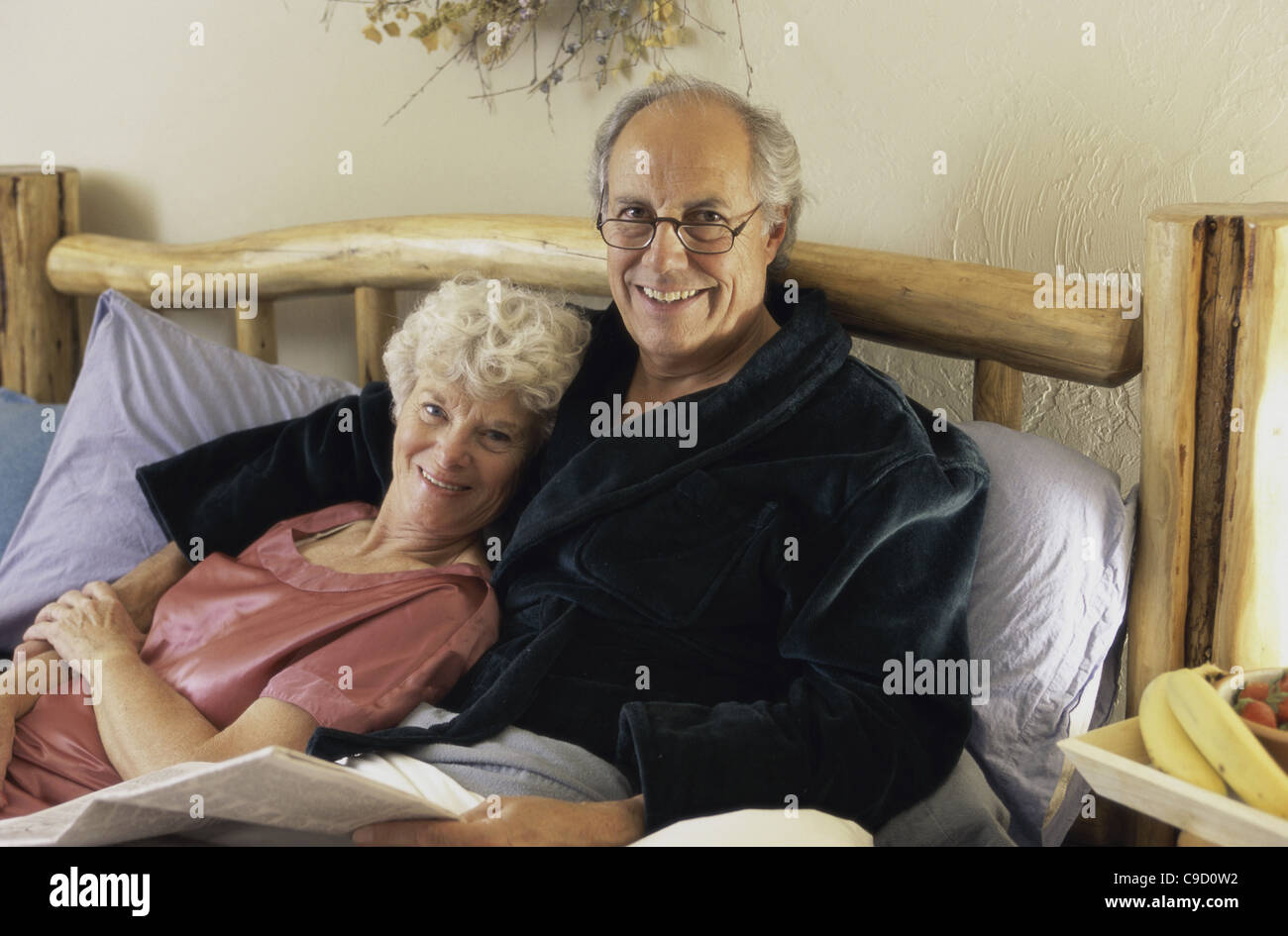 Couple lying together on bed hi-res stock photography and images - Alamy