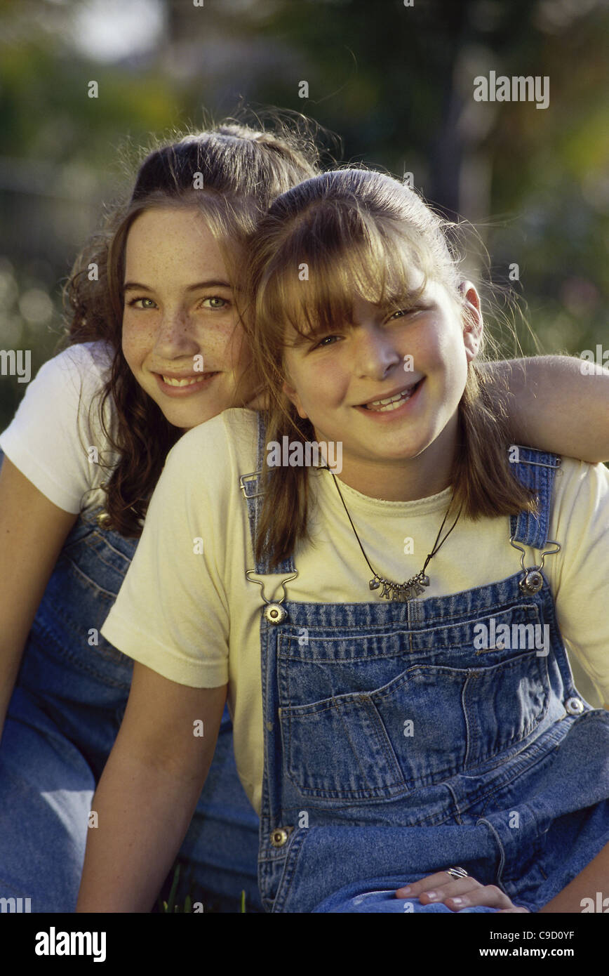 Portrait of two girls smiling Stock Photo - Alamy