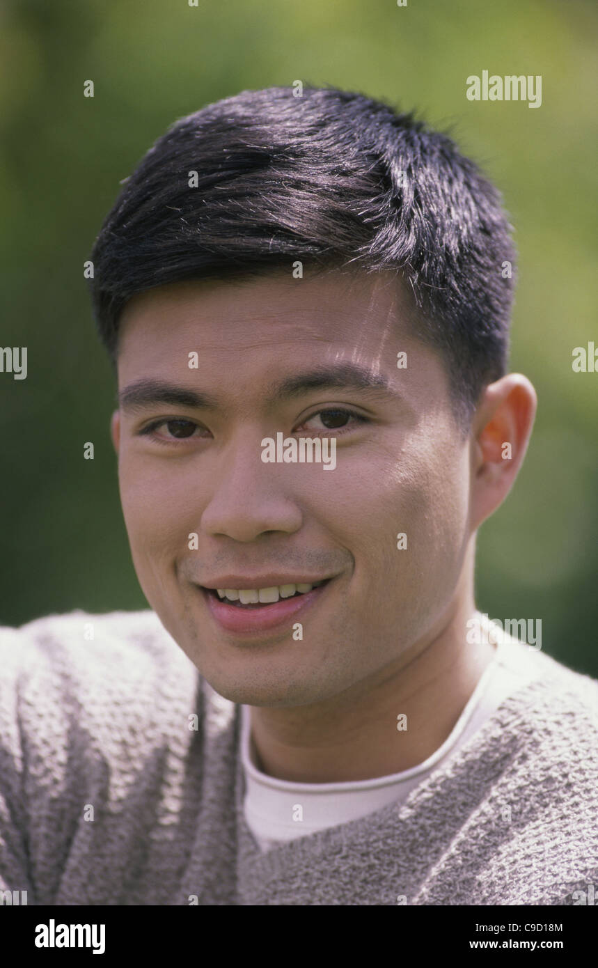 Portrait of a young man smiling Stock Photo - Alamy