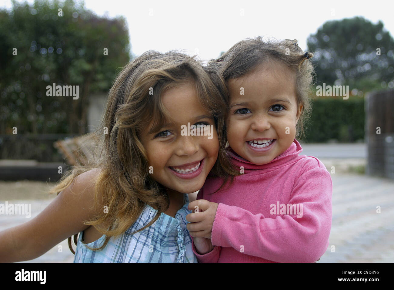 Portrait of two girls smiling Stock Photo - Alamy