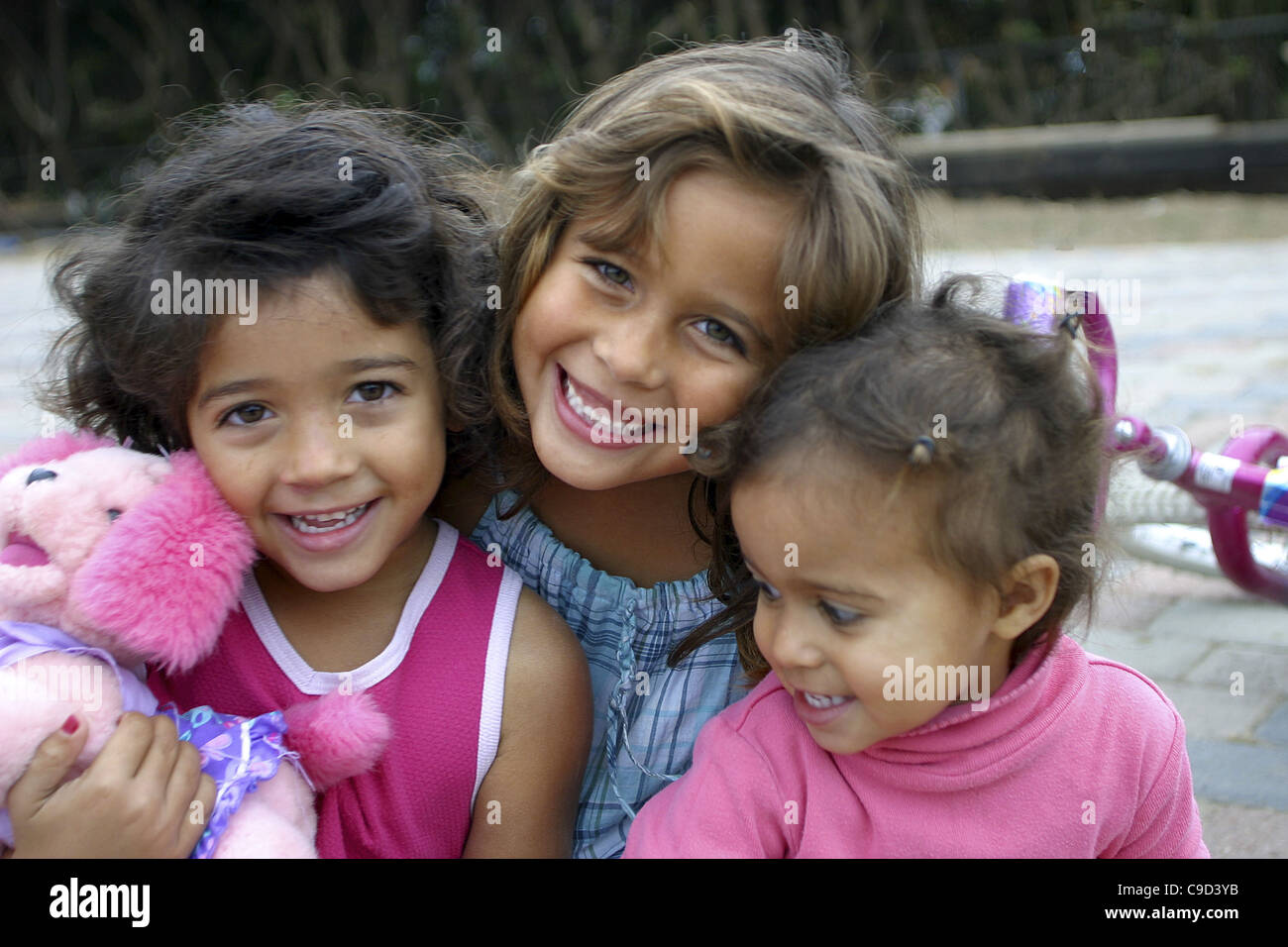 Portrait of three girls smiling Stock Photo - Alamy