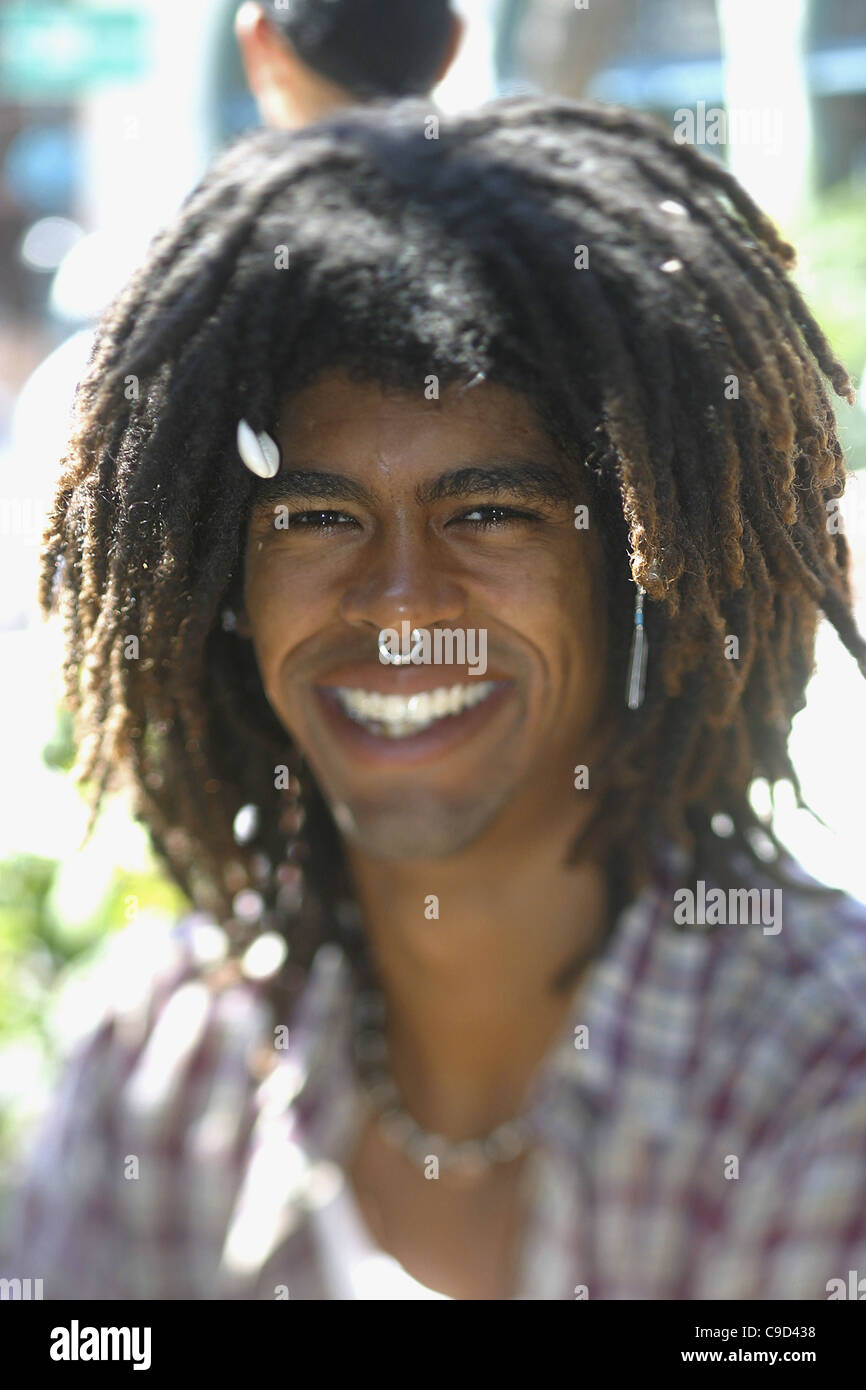 Portrait of a young man wearing a nose ring smiling Stock Photo