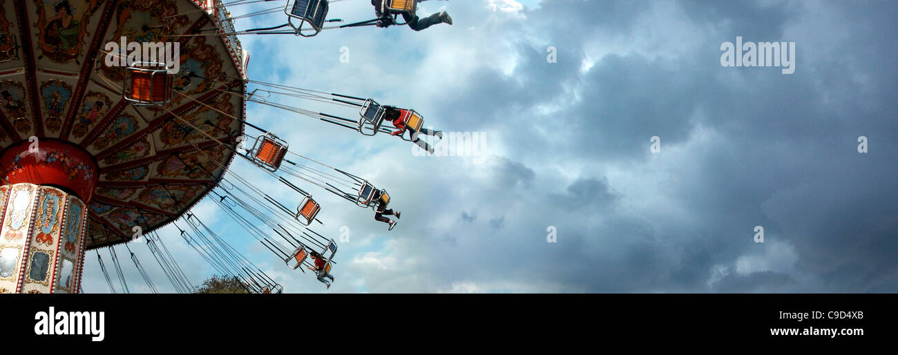 Someone On Ride Low angle view of a group of people on an amusement park ride Stock ...