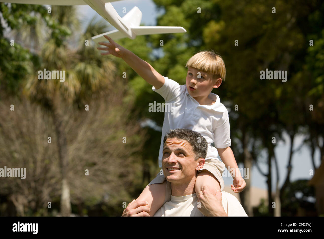 Father and son with a toy glider Stock Photo