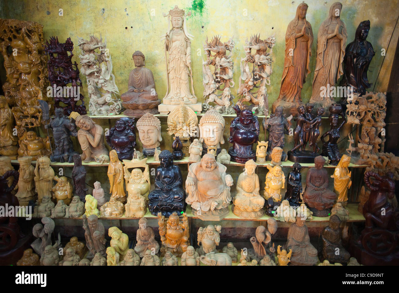 Vietnam, Hoi An, Wood Carving Statues at the Handicraft Stock