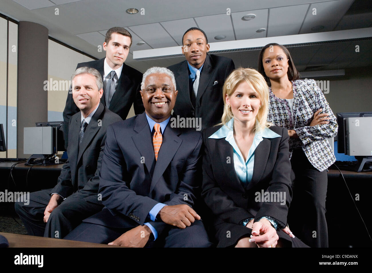 Three happy multiracial colleagues hi-res stock photography and images ...
