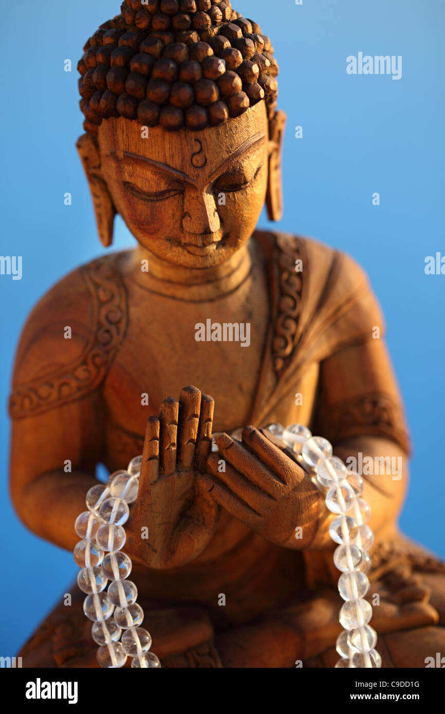 Maitreya the future Buddha holding a crystal japamala India Stock Photo