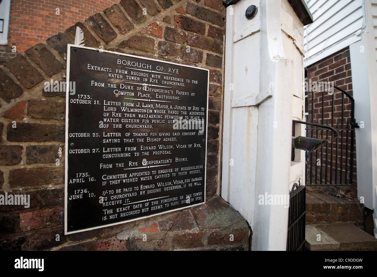 Water tower plaque with 18th century records at Rye Churchyard, East Sussex, England Stock Photo