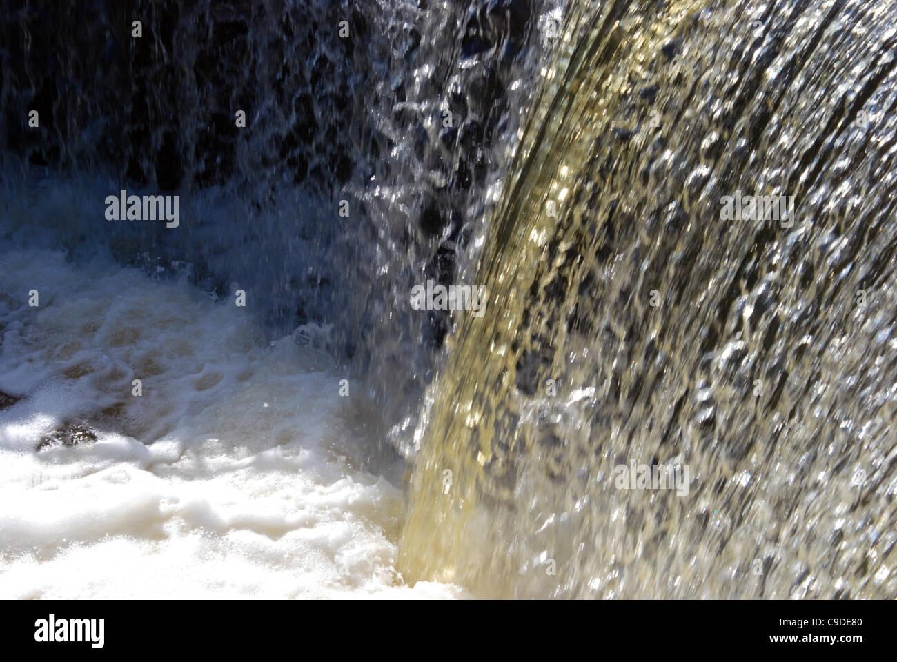 Waterfall water flow fragment. The unstoppable force of nature. Stock Photo