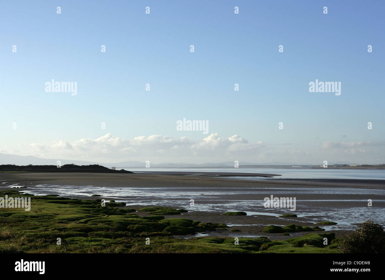 Looking across the flat estuary of the Solway,  Cumbria. Stock Photo