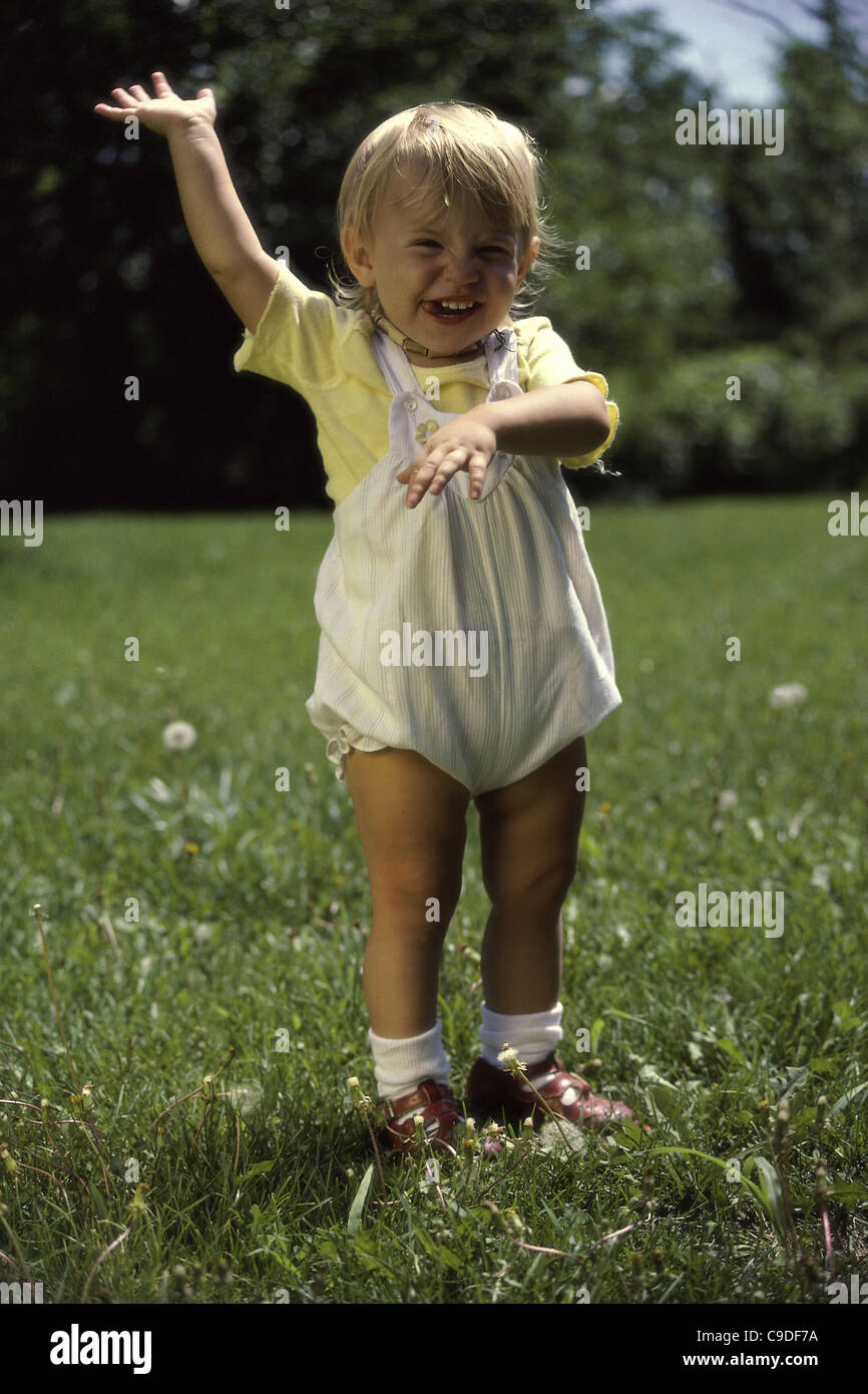 Portrait of a baby on a lawn Stock Photo - Alamy